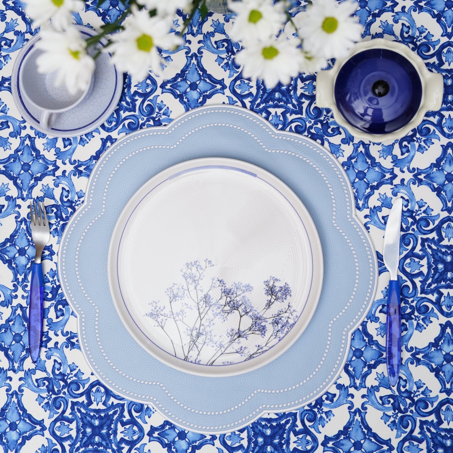 Elegant spring tablescape with the handcrafted sky blue placemat adding a fresh touch to everyday meals and holiday celebrations