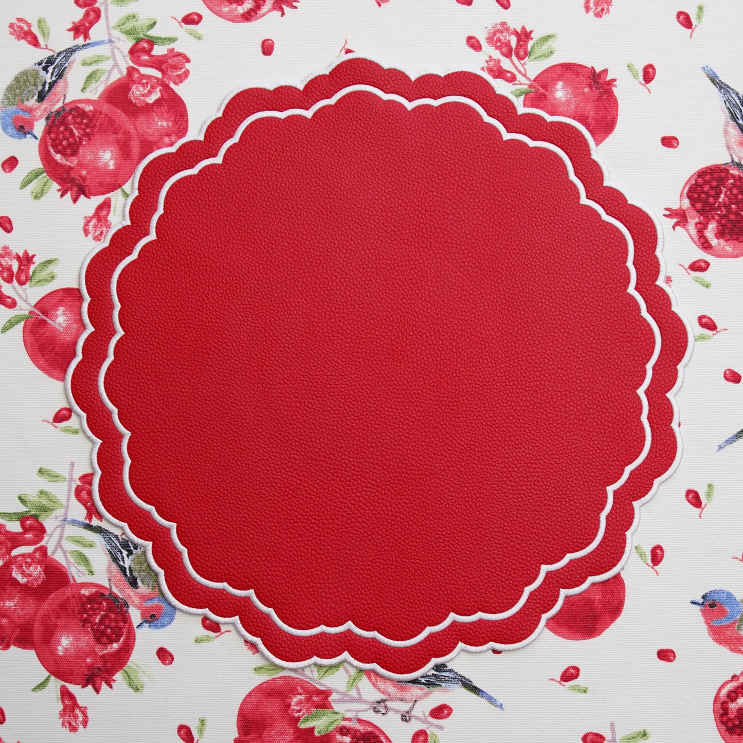 Scarlett Red Embroidered Faux Leather Placemat – Styled for luxurious table settings, featuring exquisite craftsmanship, eco-friendly vegan materials, and an effortlessly maintainable finish. Exclusively by PNR Decor.