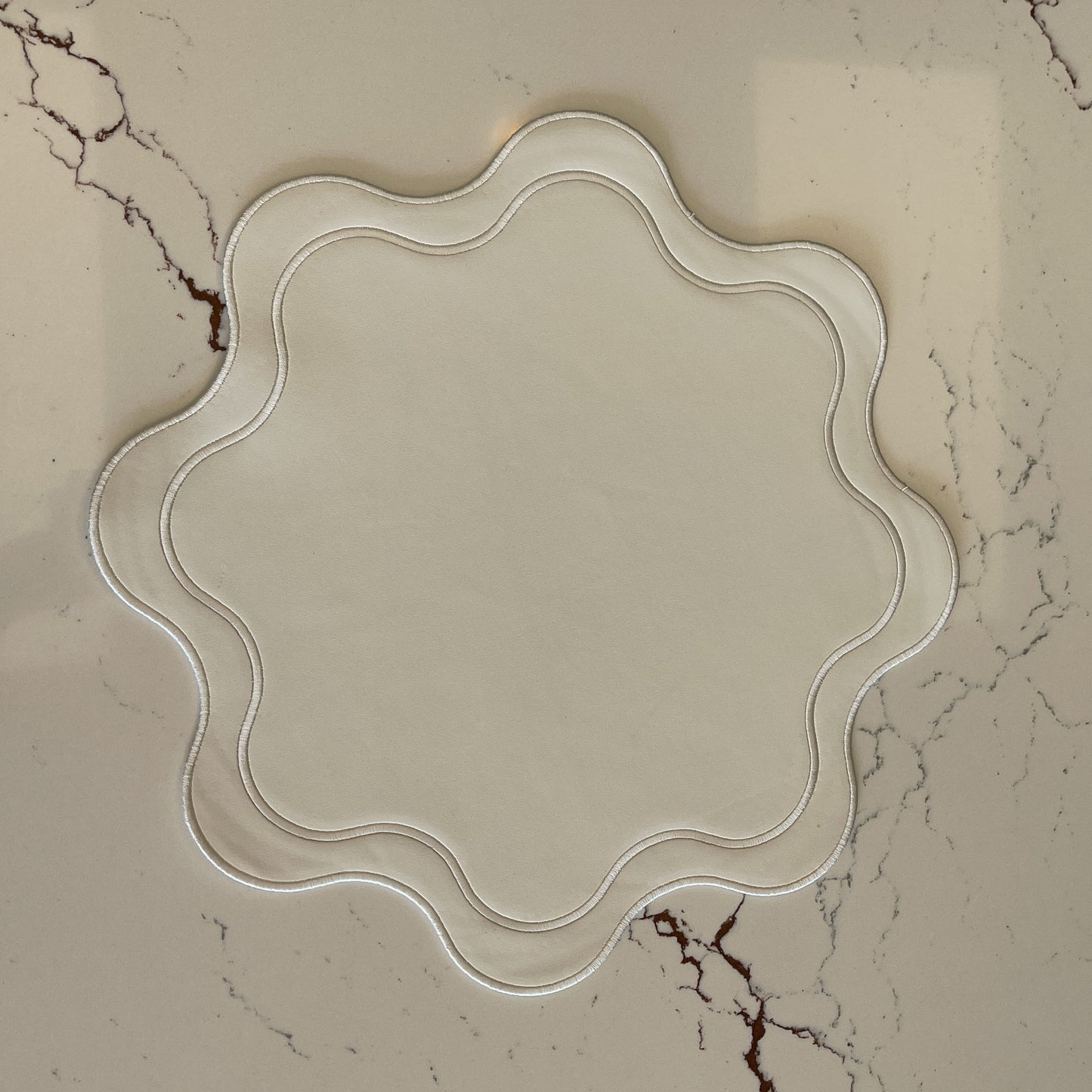 Haven White Wavy Edge Faux Leather Placemat (Greenery) – detailed shot highlighting the stain-resistant, handcrafted quality and layered construction of the faux leather surface.