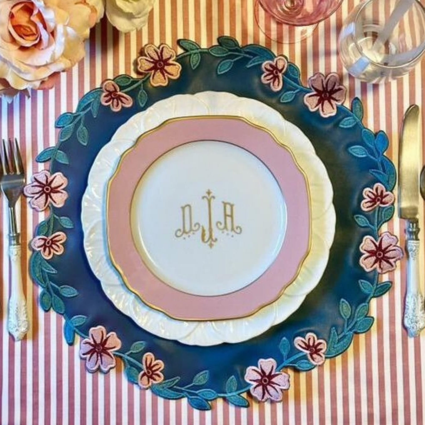 Unity Blue Round Pink Faux Leather Placemat
– expertly handcrafted from eco-friendly, vegan faux leather with elegant embroidery and double-layered design, stain-resistant and durable. Exclusively by PNR Decor.