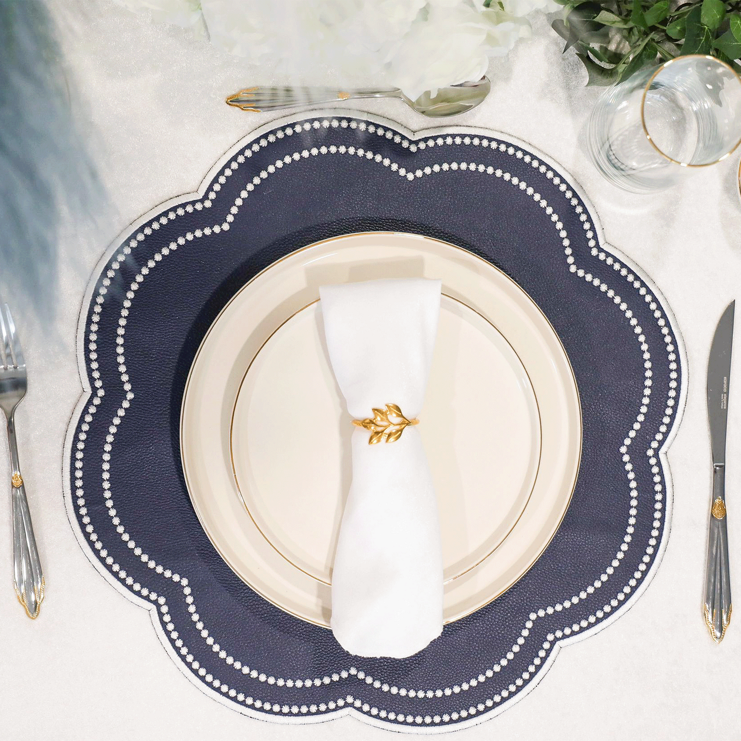 Nurture Blue Round Faux Leather Placemat – close-up view showing the intricate embroidery, double-layer stitching, and premium vegan faux leather texture. Exclusively by PNR Decor.