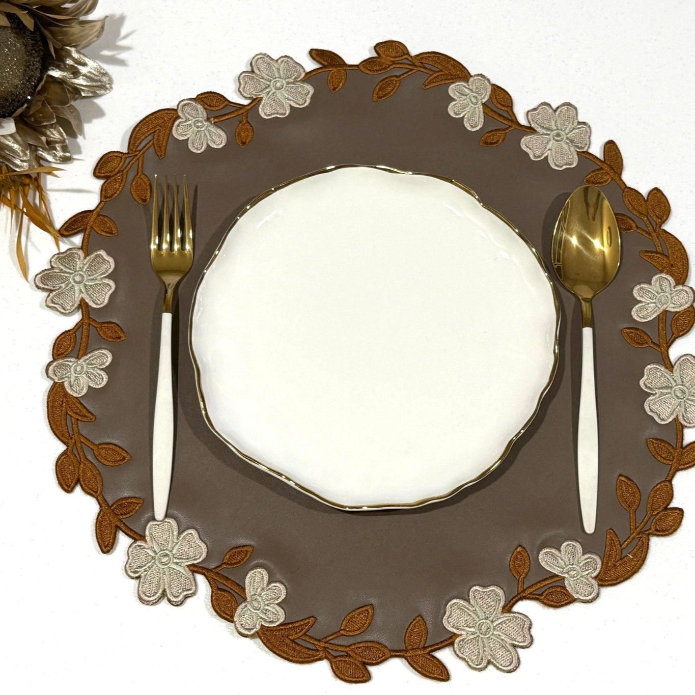 Unity Brown Round Faux Leather Placemat
– expertly handcrafted from eco-friendly, vegan faux leather with elegant embroidery and double-layered design, stain-resistant and durable. Exclusively by PNR Decor.