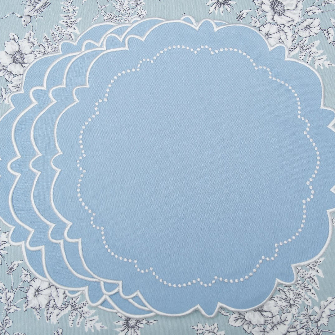 Spring table decor ideas highlighting the exquisite silk thread embroidery on the classic blue fabric placemat