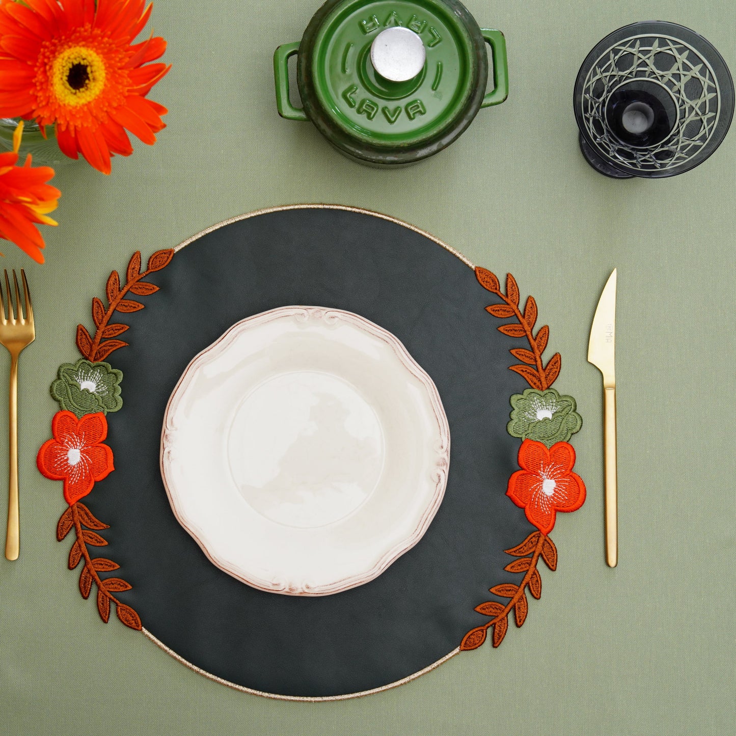 Elegant placemat arranged for high-end dining with fine embroidered detail
