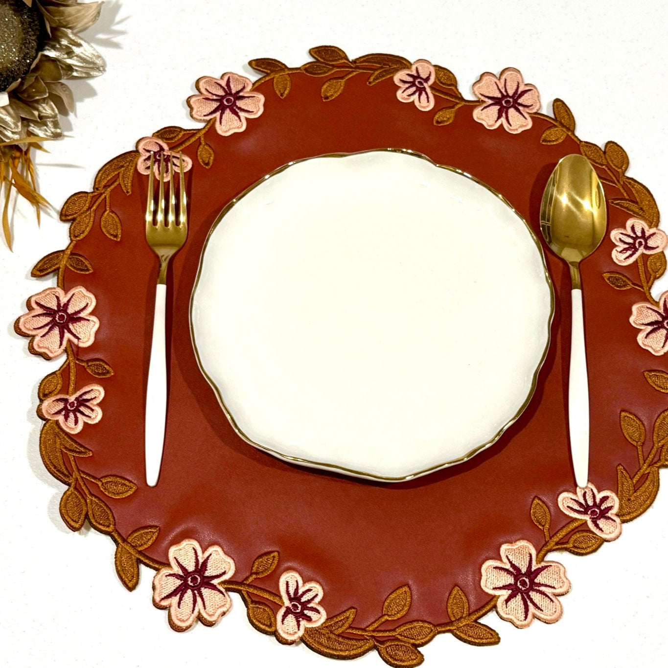 Unity Dark Orange Round Faux Leather Placemat
– expertly handcrafted from eco-friendly, vegan faux leather with elegant embroidery and double-layered design, stain-resistant and durable. Exclusively by PNR Decor.
