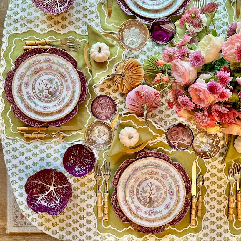 Premium green and white placemat with fine embroidered accents, ideal for stylish dining table setups.