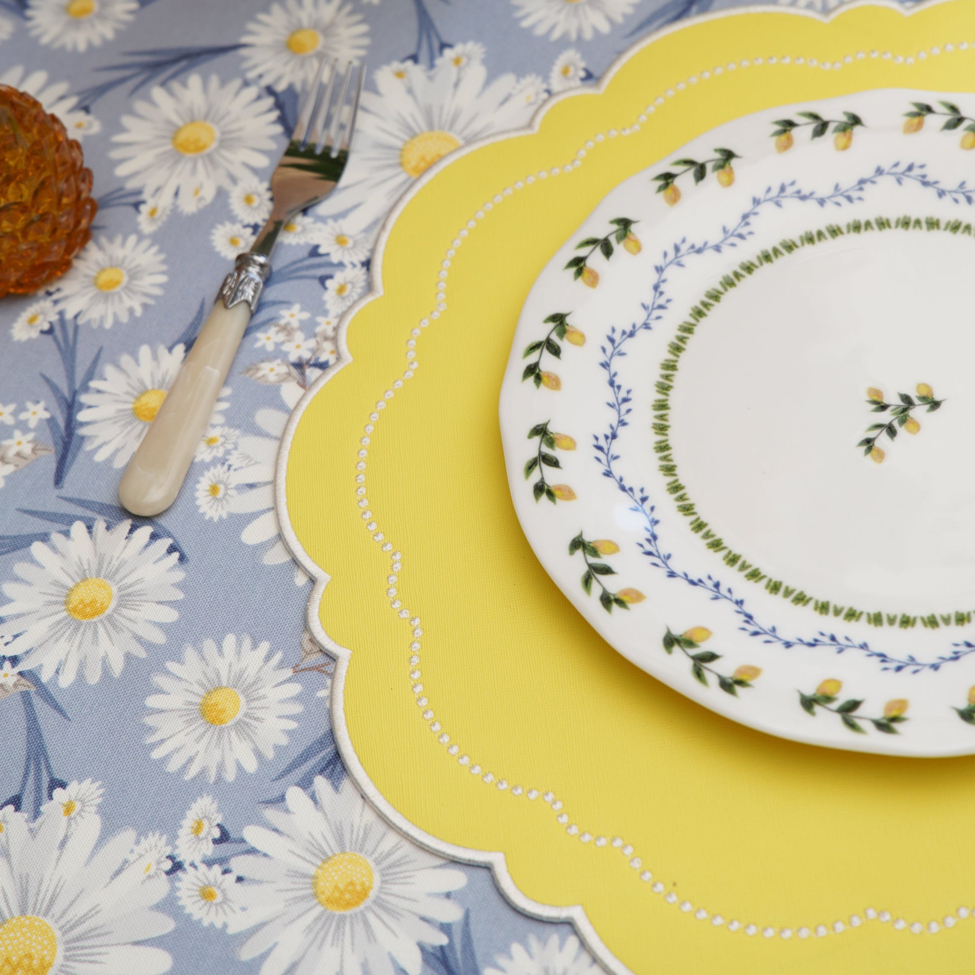 Elegant round placemat with textured vegan surface and intricate stitching