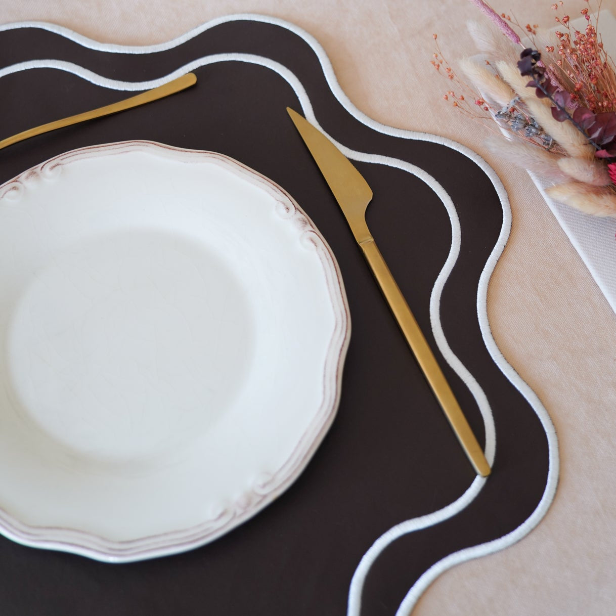 Haven Brown Wavy Edge Faux Leather Placemat – close-up view showing the intricate embroidery, double-layer stitching, and premium vegan faux leather texture.