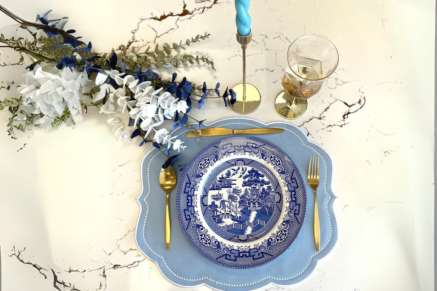 Velour light blue faux leather placemat with delicate embroidery for a luxurious dining experience