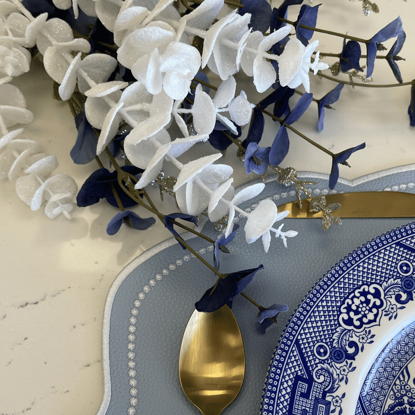 Velour Light Blue Rectangle Faux Leather Placemat
– close-up view showing the intricate embroidery, double-layer stitching, and premium vegan faux leather texture. Exclusively by PNR Decor.