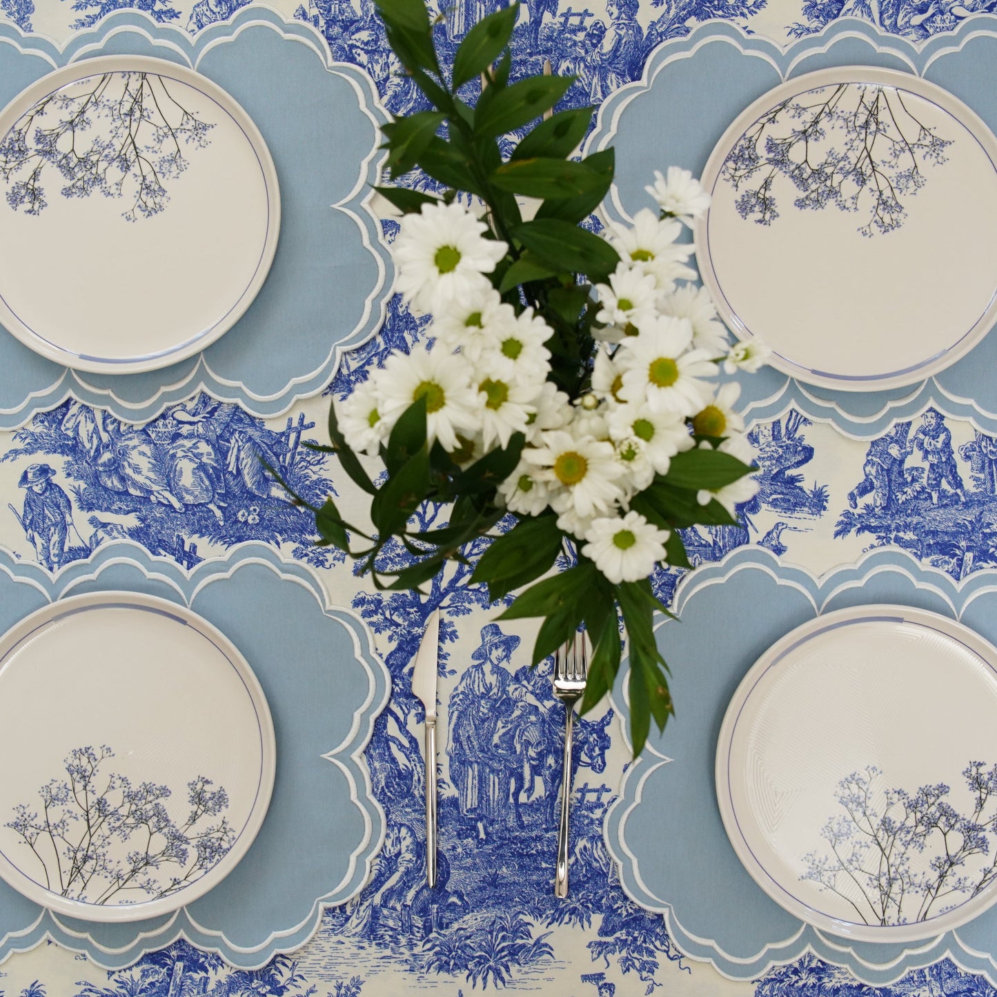 High-quality spring table linens showcasing the detail of the Aquelle Baby Blue handmade embroidered set