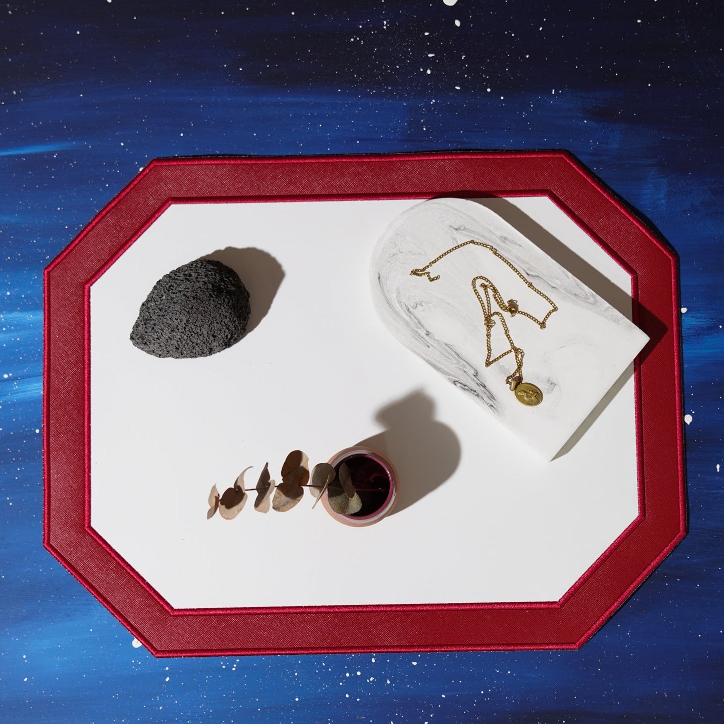 Make every occasion memorable with the Zenvia Red Octagon Faux Leather Placemat. Designed using eco-friendly vegan leather, this luxurious placemat combines style and practicality, making it perfect for weddings, special celebrations, and formal dining. Available only at PNR Decor.