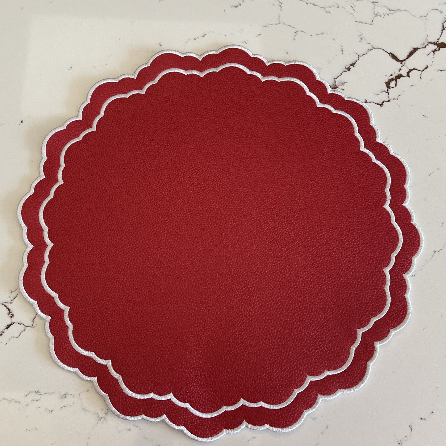 Scarlet Red Round Faux Leather Placemat
– detailed shot highlighting the stain-resistant, handcrafted quality and layered construction of the faux leather surface. Exclusively by PNR Decor.