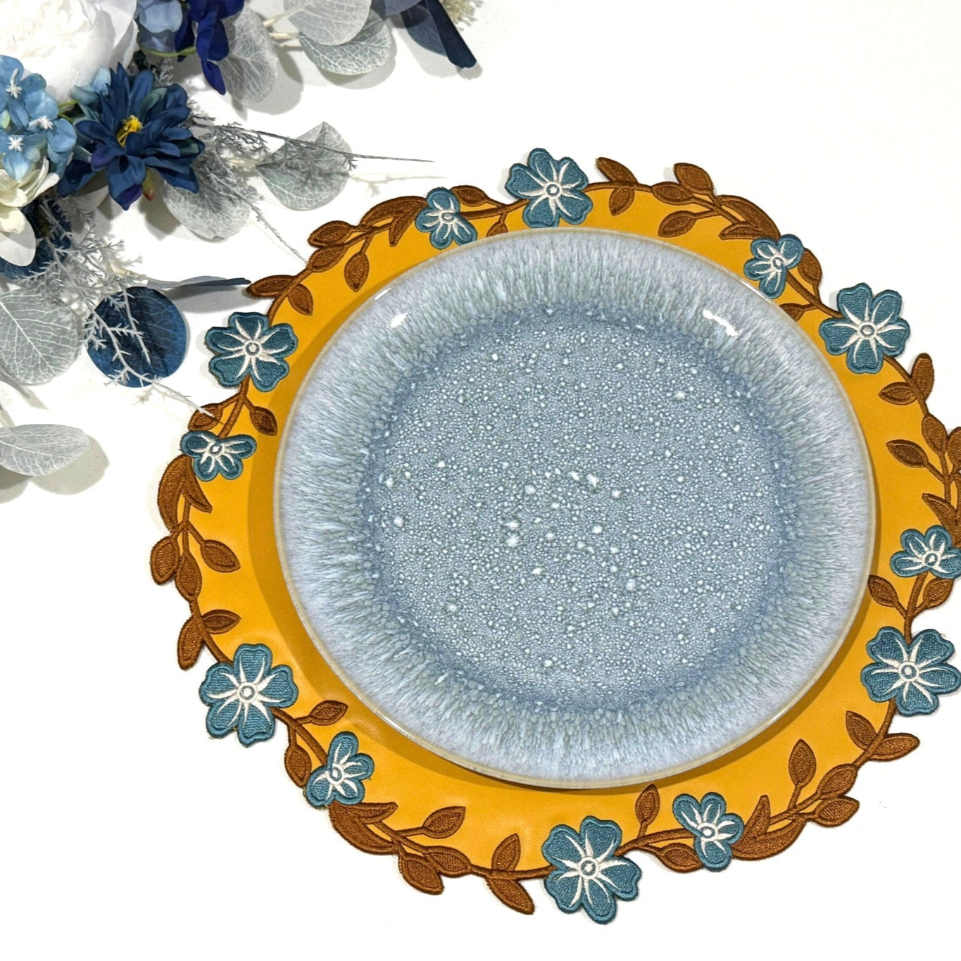 Unity Yellow Round Faux Leather Placemat
– expertly handcrafted from eco-friendly, vegan faux leather with elegant embroidery and double-layered design, stain-resistant and durable. Exclusively by PNR Decor.