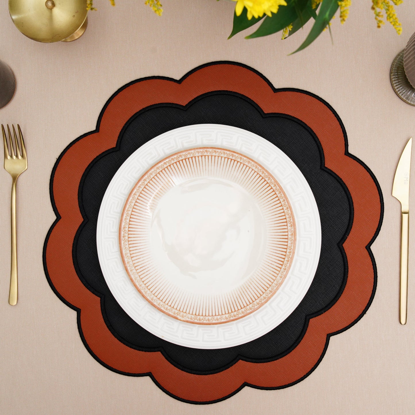 Elegant round placemat displayed with formal dinnerware