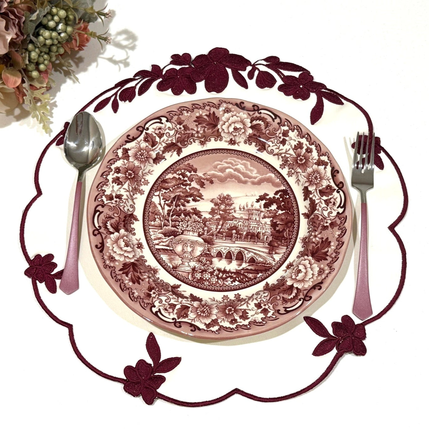 Lotus White Burgundy Round Faux Leather Placemat – expertly handcrafted from eco-friendly, vegan faux leather with elegant embroidery and double-layered design, stain-resistant and durable. Exclusively by PNR Decor.