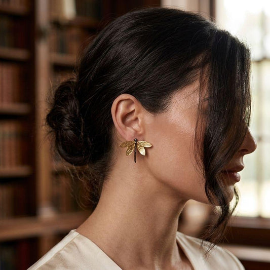 A pair of handcrafted two-tone dragonfly statement earrings made of 925 sterling silver. The body is oxidized dark silver, and the intricately textured wings are 18K gold-plated. Measuring 3.5 cm by 4 cm.