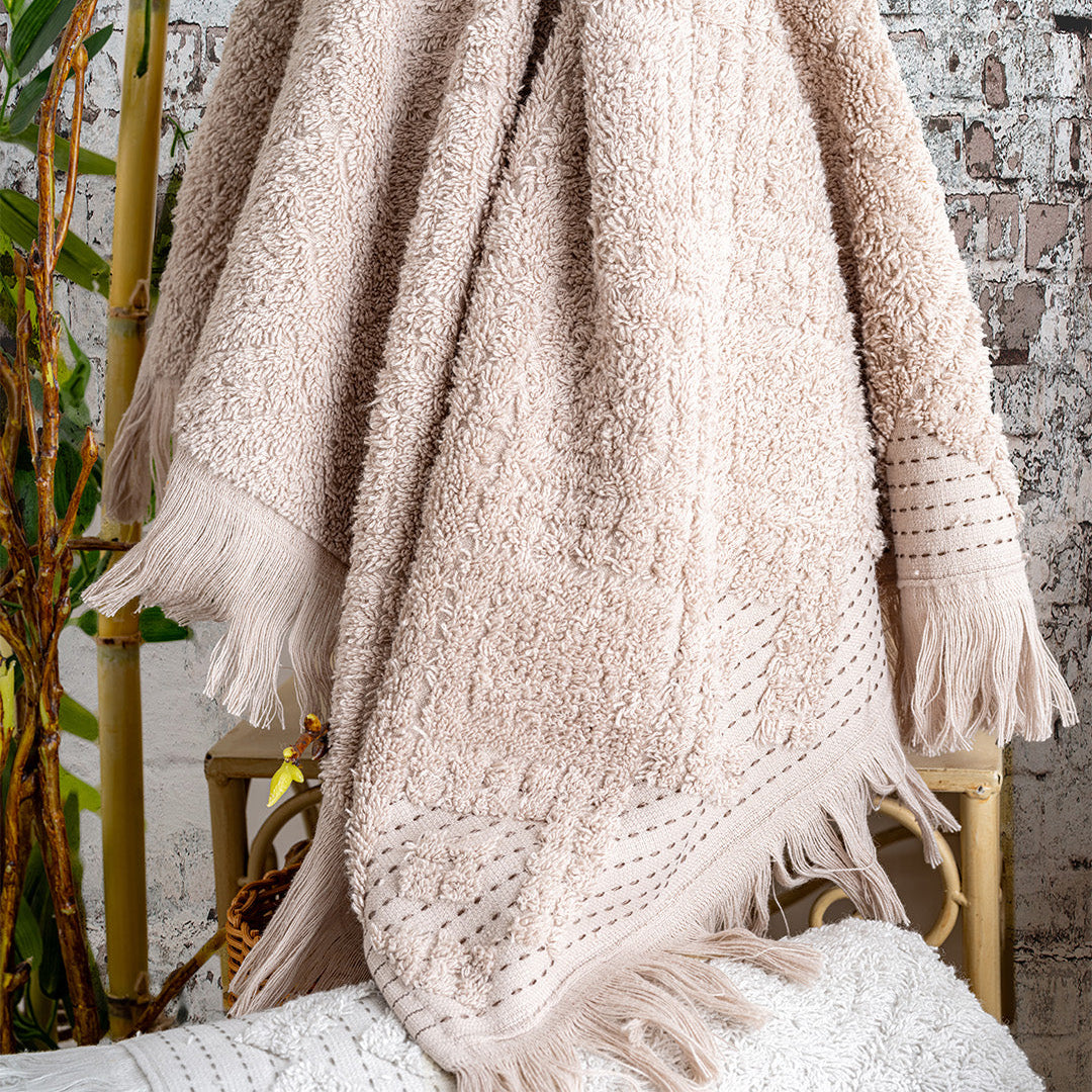 Close up of Lavaya Perla towels showing embroidered detail and soft fabric texture by PNRDECOR ship from USA