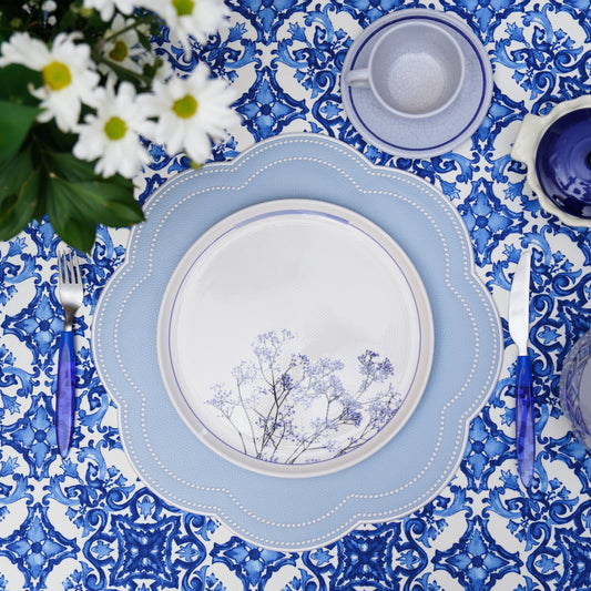 Sky blue scalloped faux leather placemat on elegant dining table – handmade and stain-resistant design