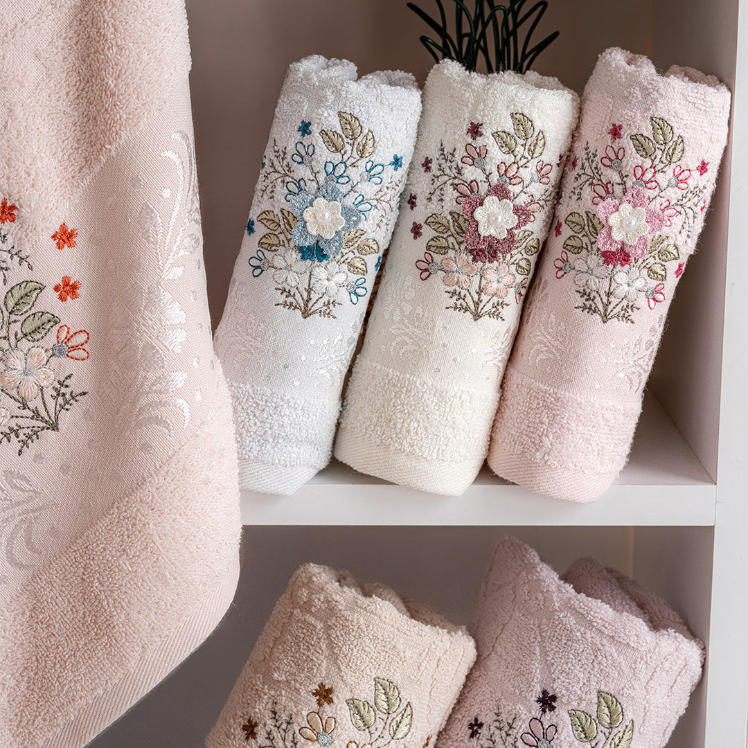 Close up of Pluma cotton towels showing embroidered detail and soft cotton texture by PNRDECOR ship from USA