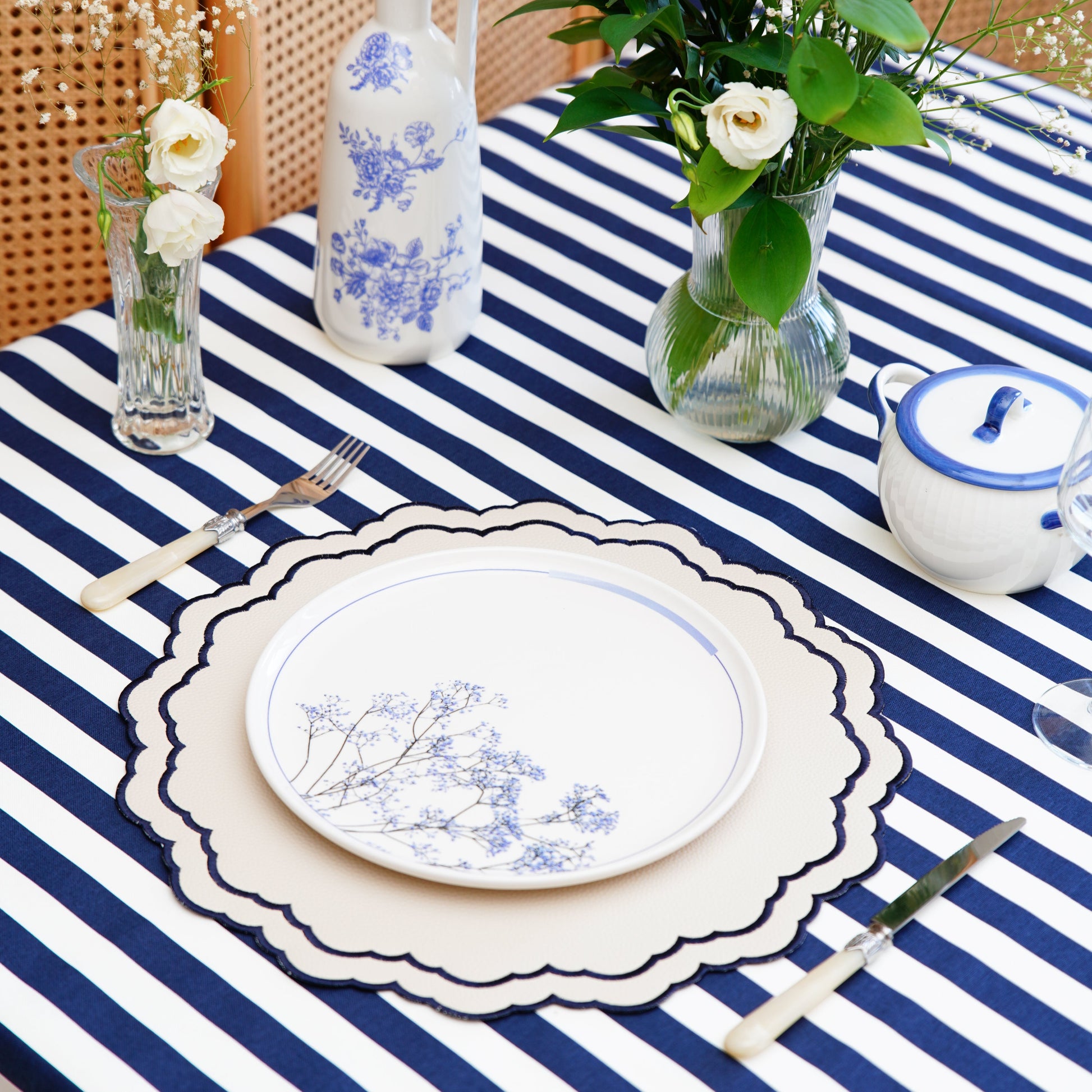 Scarlett White Navy Embroidered Placemat – Crafted from eco-friendly faux leather with sophisticated embroidery, double-layer protection, and remarkable durability. A refined touch by PNR Decor.