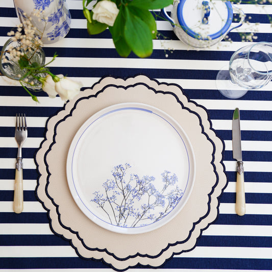 Scarlett White Round Faux Leather Placemat – Luxuriously handcrafted with vegan faux leather, featuring intricate navy embroidery, double-layered durability, and an easy-to-clean, stain-resistant surface. Exclusively designed by PNR Decor.
