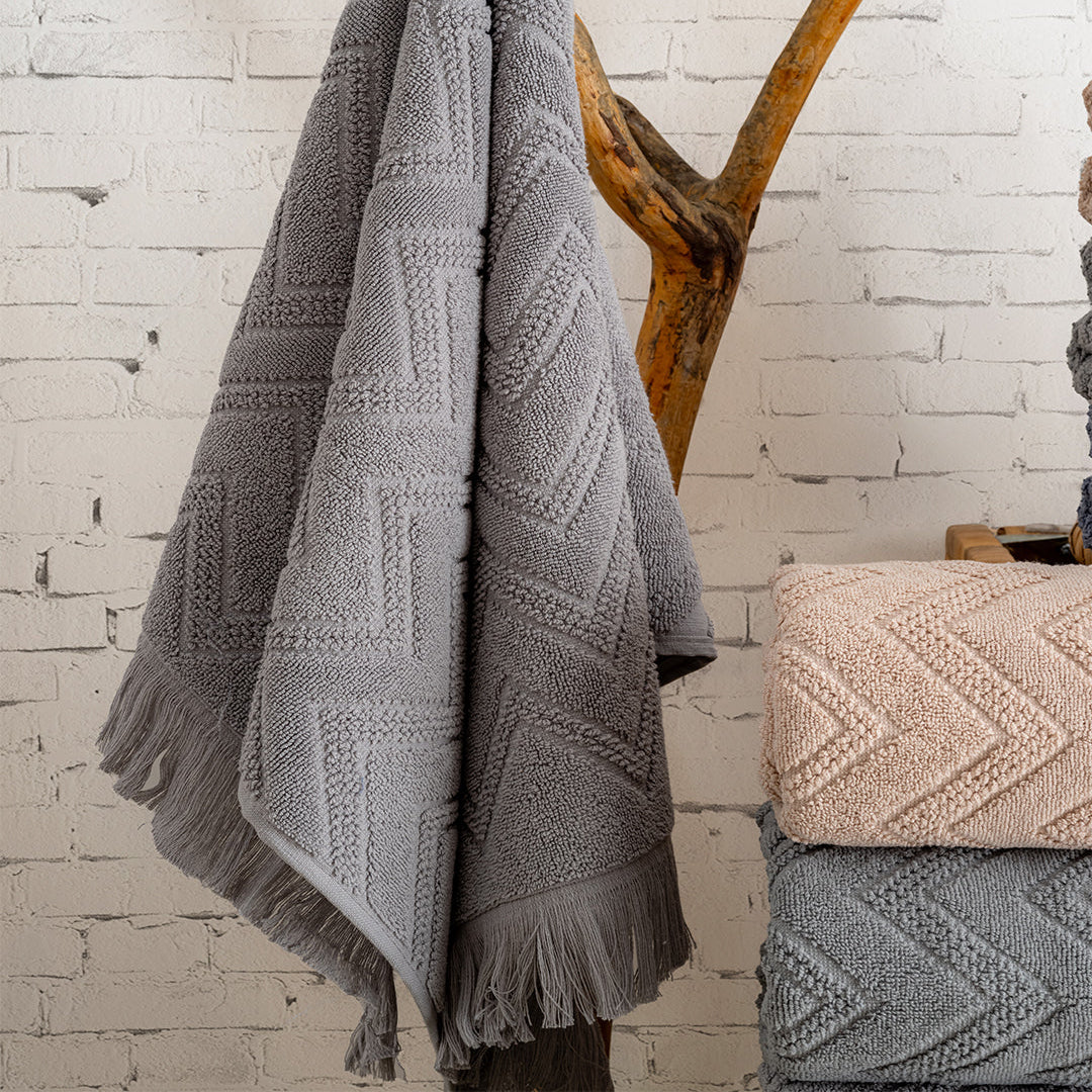 Close up of Serava Oslo towels showing embroidered detail and soft fabric texture by PNRDECOR ship from USA