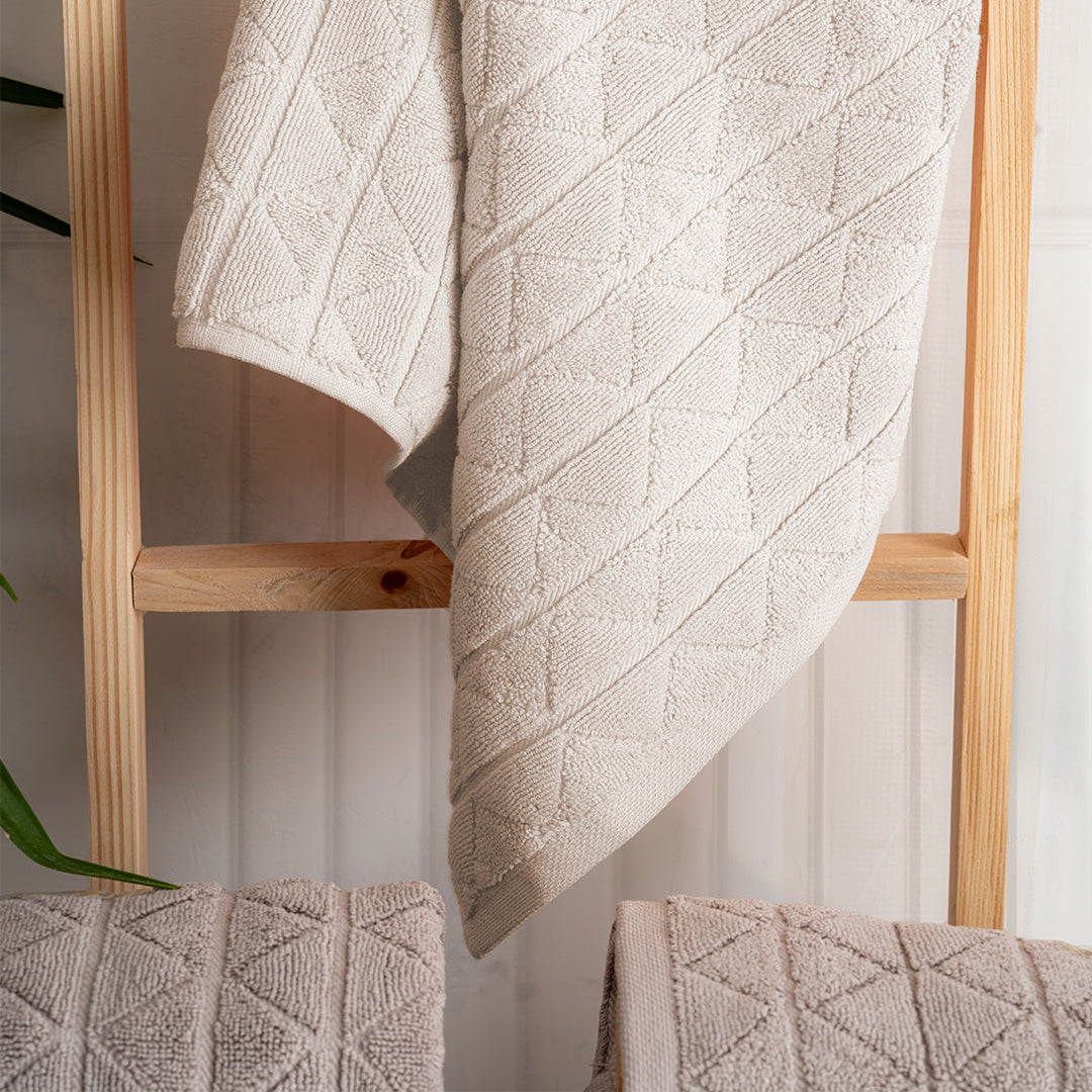 Close up of Serava Royal towels showing embroidered detail and soft fabric texture by PNRDECOR ship from USA