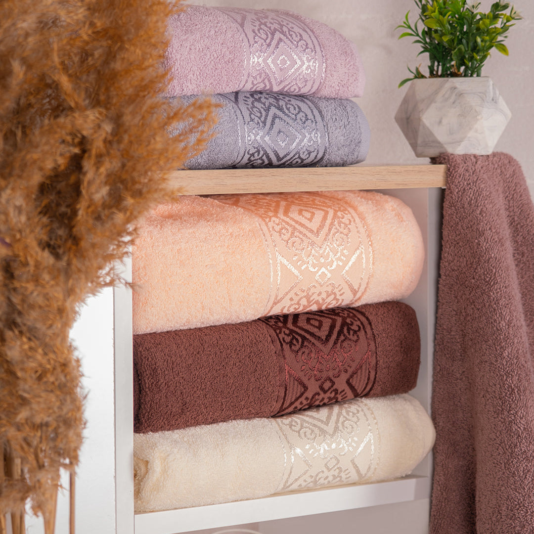 Soakta embroidered hand towel set presented in a bathroom setup for guest ready styling by PNRDECOR ship from USA