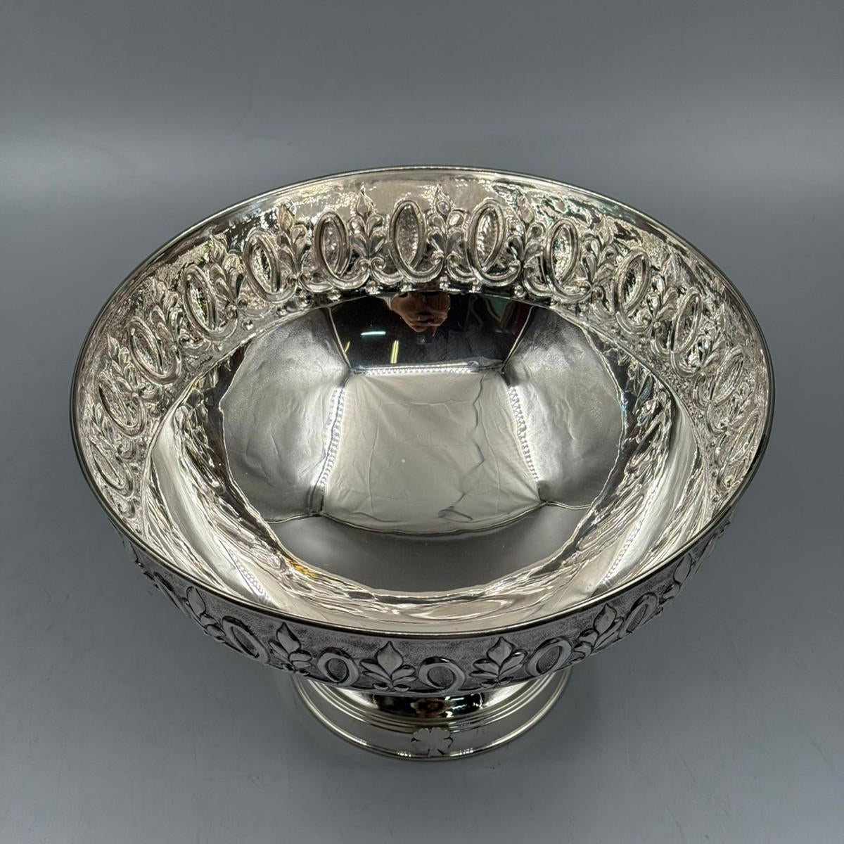 High angle view of antique silver deep bowl with ornate relief rim by PNR Decor ship from USA