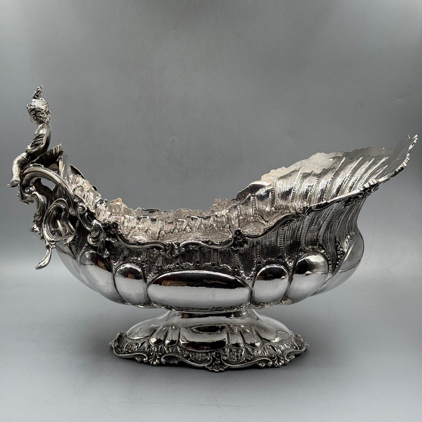 Full view of ornate Rococo silver gondola centerpiece with cherub figurine