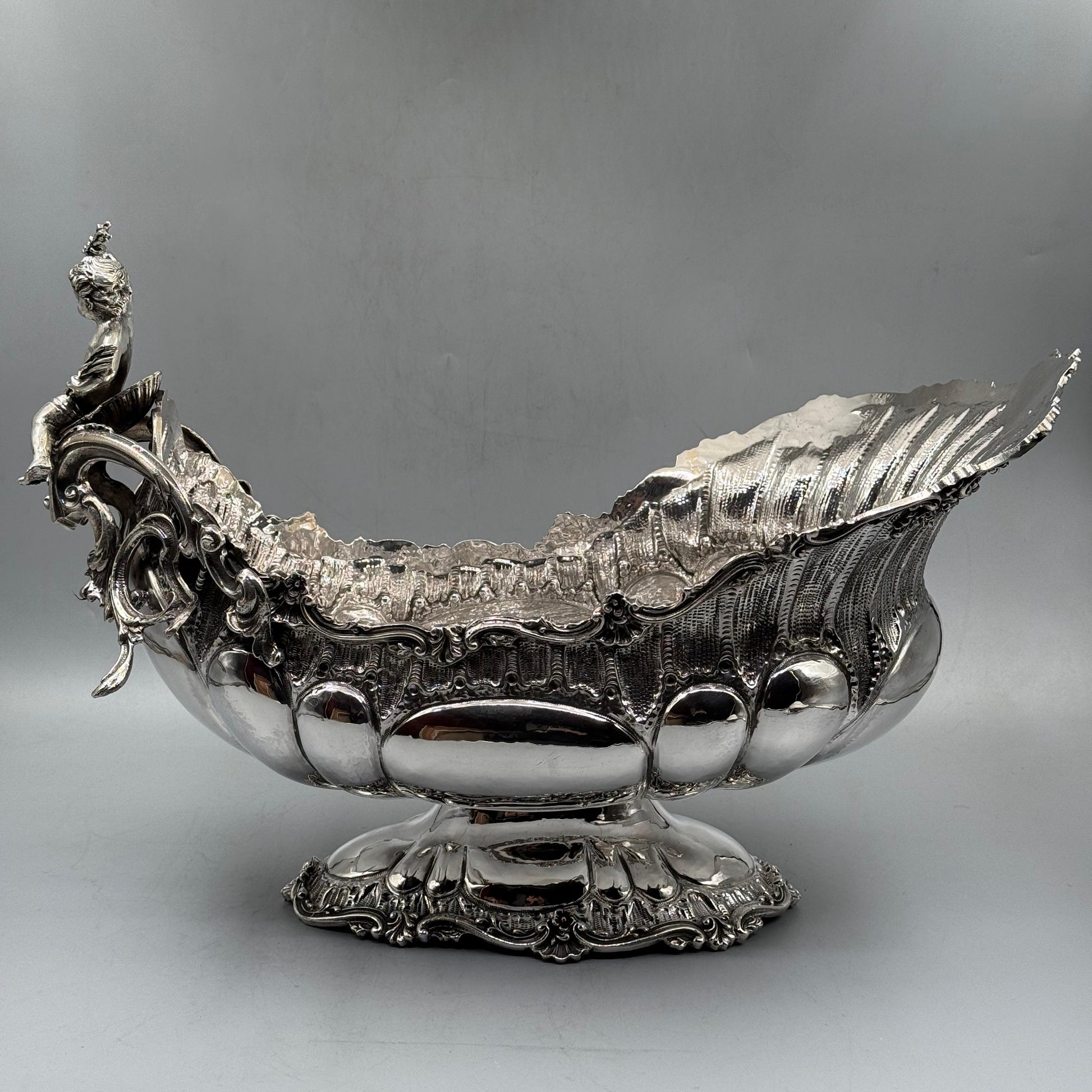 Full view of ornate Rococo silver gondola centerpiece with cherub figurine