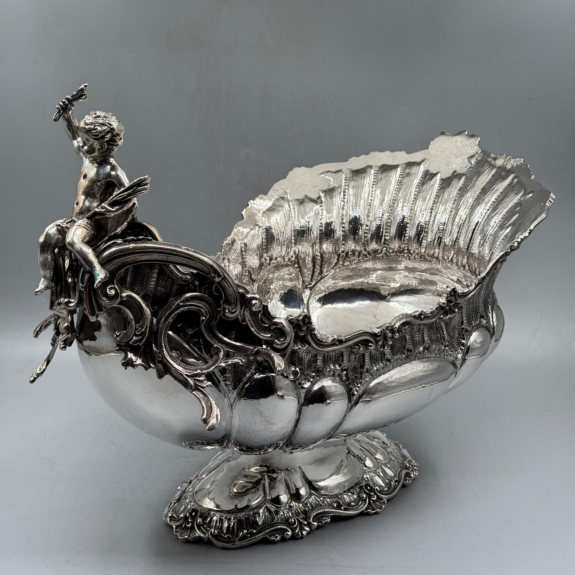 Antique silver gondola centerpiece with Rococo cherub figure, side view
