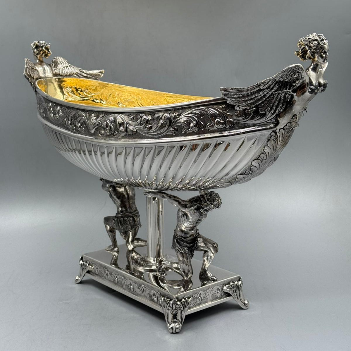 Antique silver gondola centerpiece supported by Hercules figures, decorative detail
