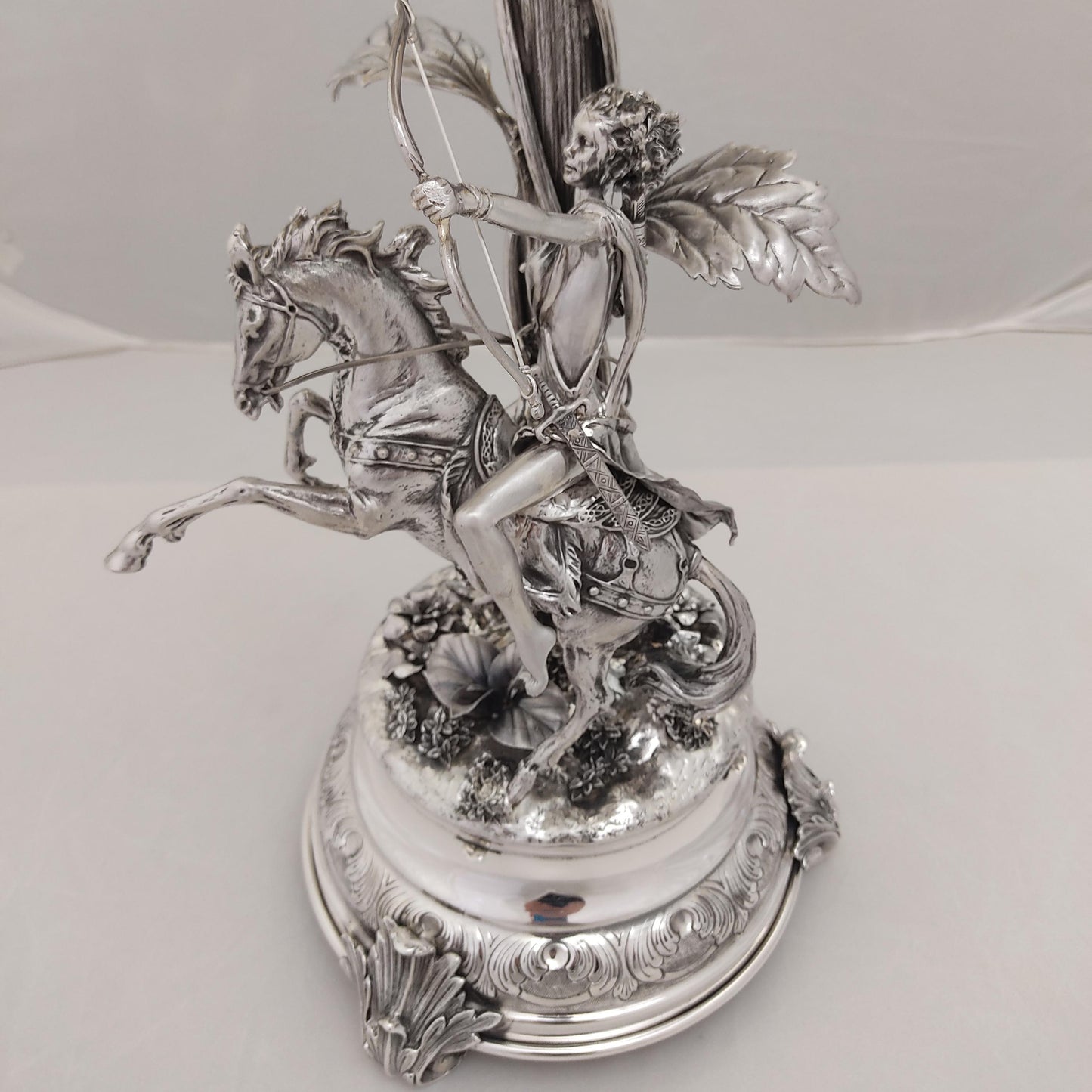 Close-up of horse rider figure on antique silver centerpiece
