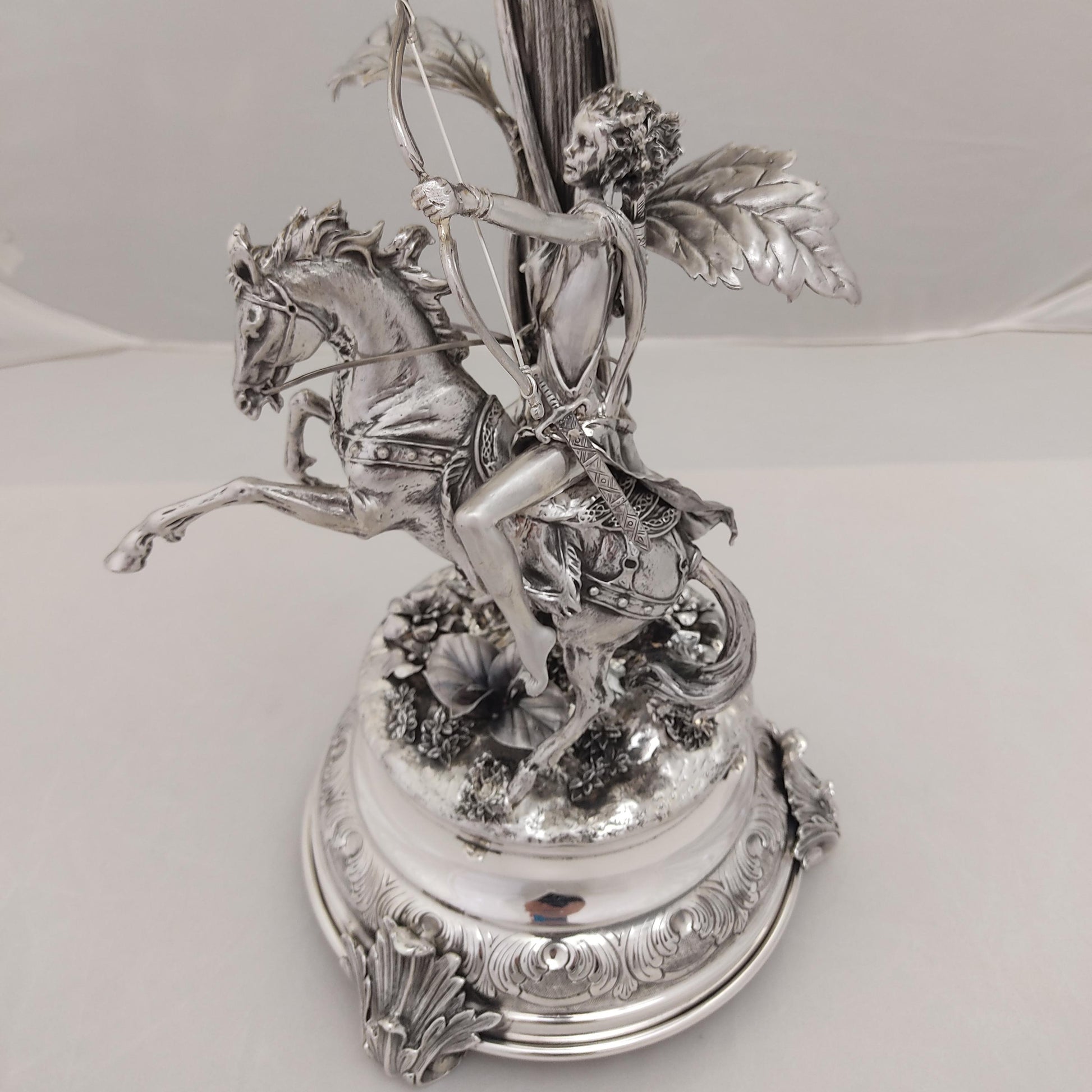 Close-up of horse rider figure on antique silver centerpiece