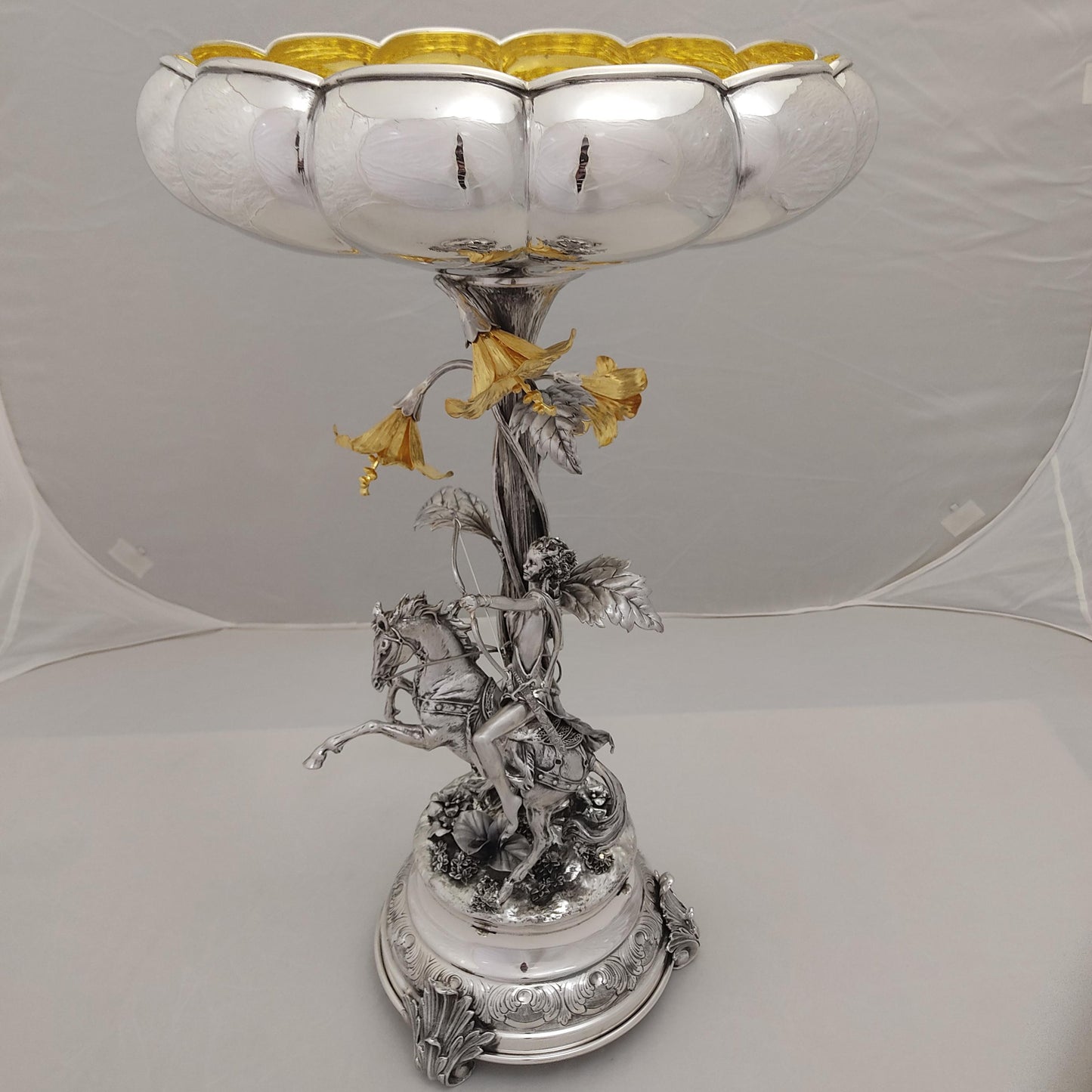 Antique silver centerpiece with horse rider and gilded floral bowl