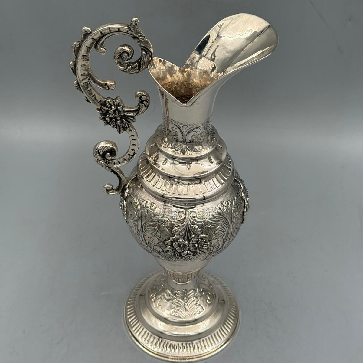Front view of highly ornate antique silver ewer with floral relief by PNR Decor ship from USA