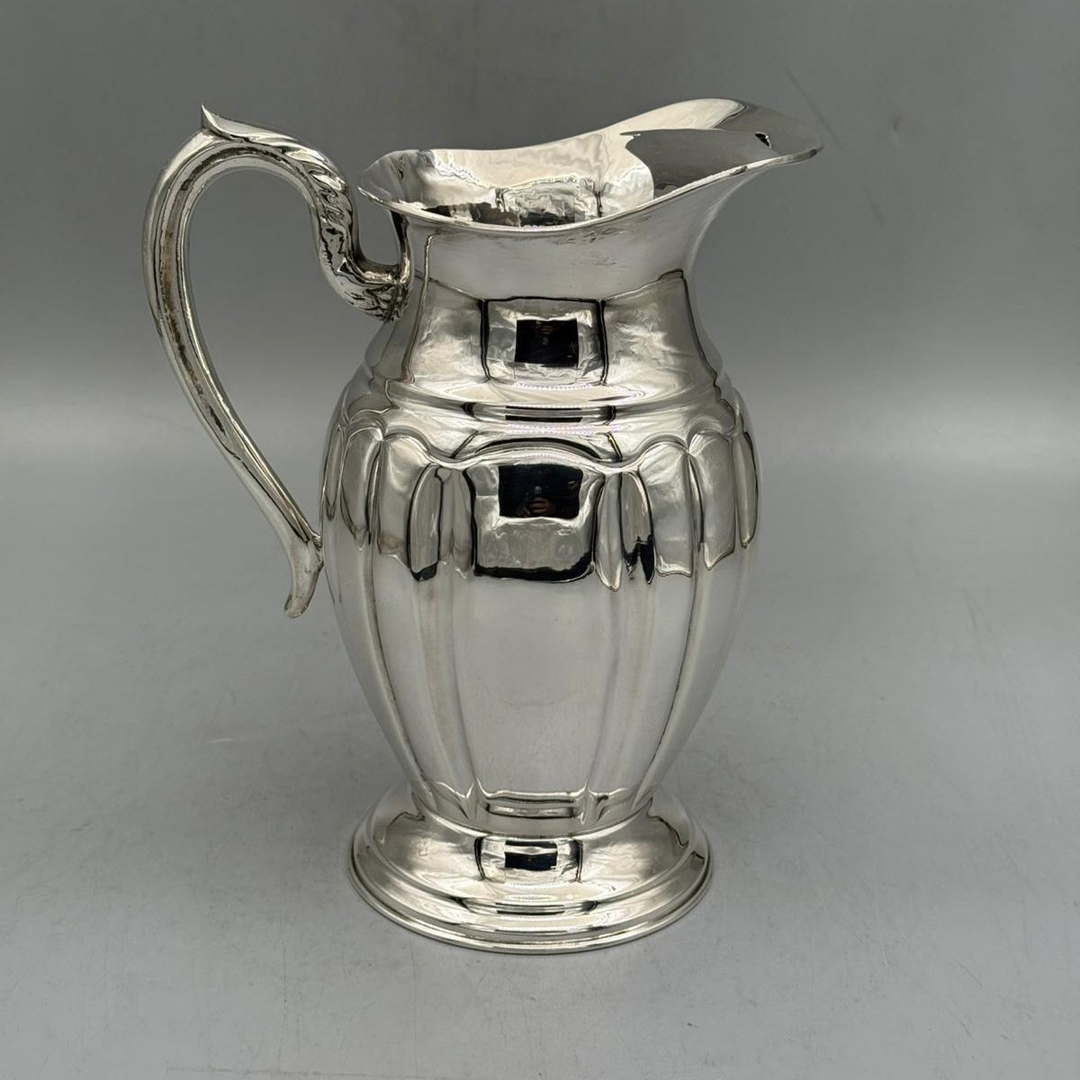 Front view of antique silver pitcher with wide panel fluted body by PNR Decor ship from USA