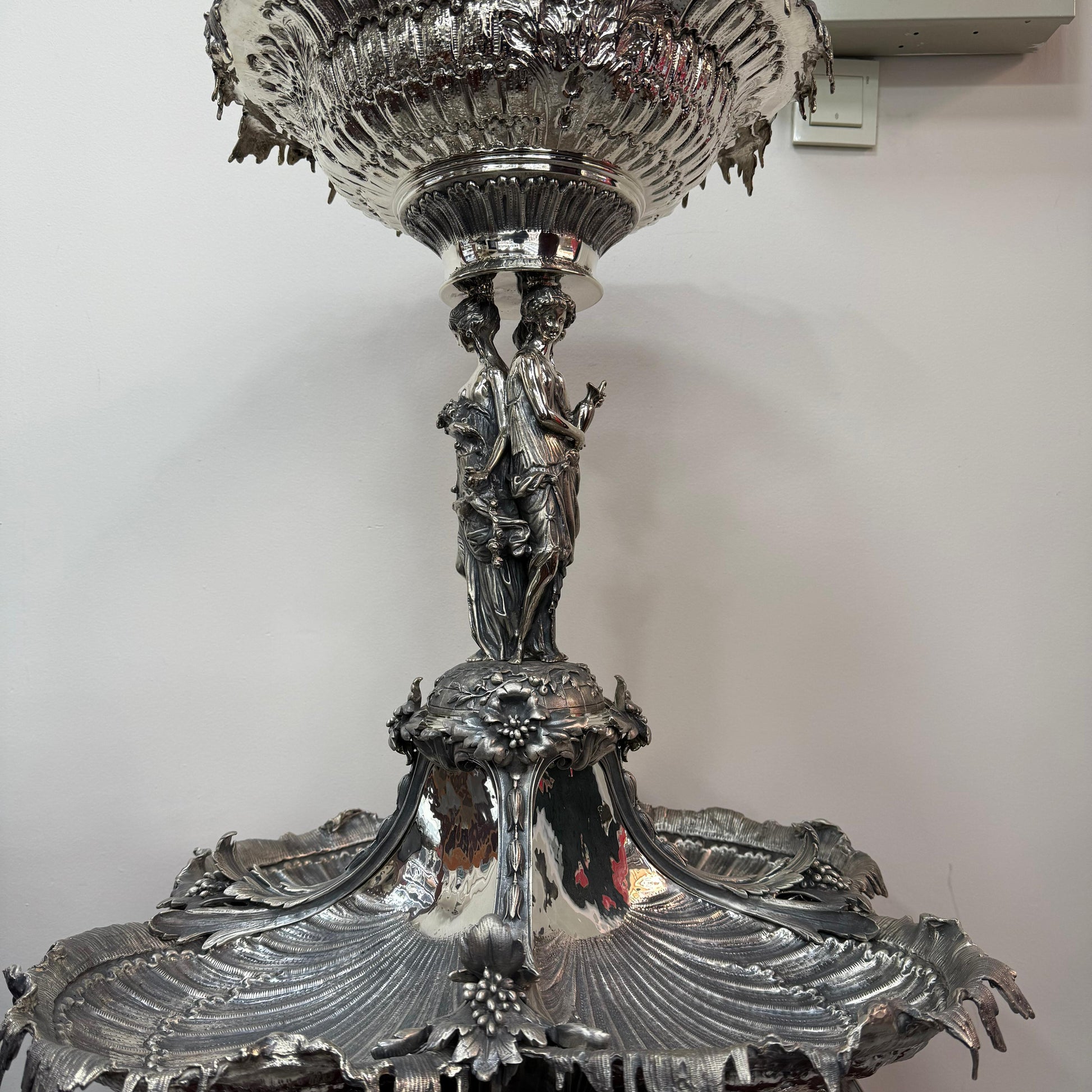 Full view of large antique silver shell form centerpiece with ornate detailing