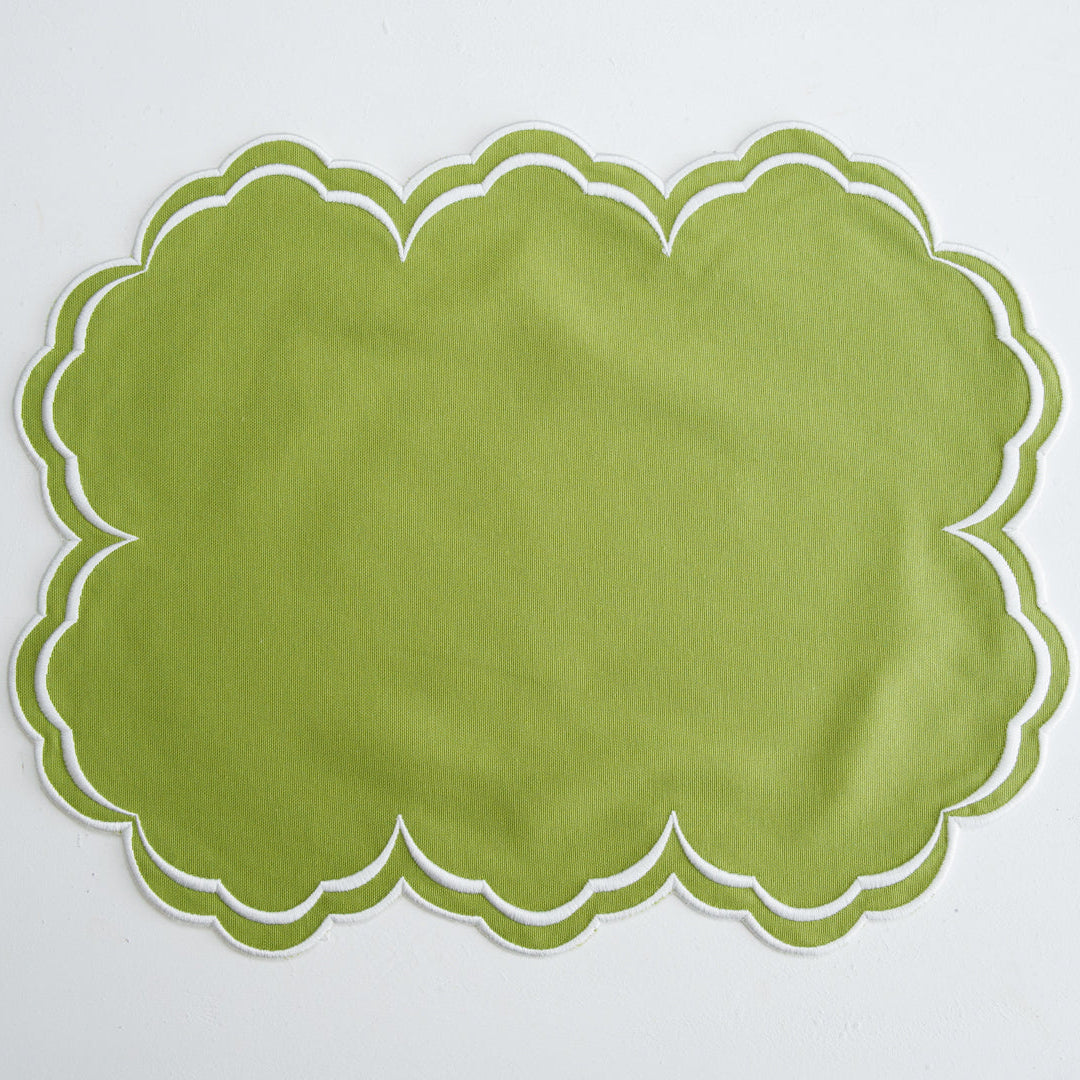 Spring table setting featuring the luxury embroidered Aquelle Green cotton placemat with silk thread detailing