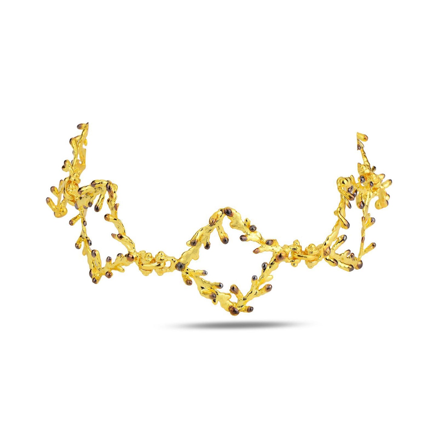 Artisan-made woodland jewelry showing a substantial 17-gram bracelet cast from real pine branches. The unique contrast between the radiant gold and dark oxidized tips showcases premium craftsmanship.