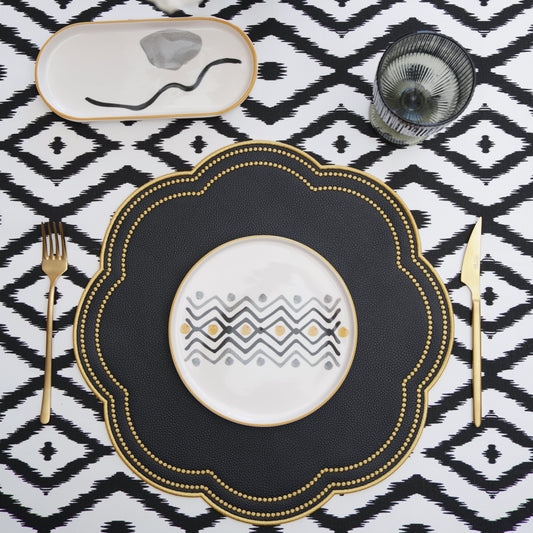 Nurture Black Gold Round Vegan Leather Placemat – designed for refined table settings, this elegant placemat is made from eco-conscious materials with a smooth, embroidered finish.
