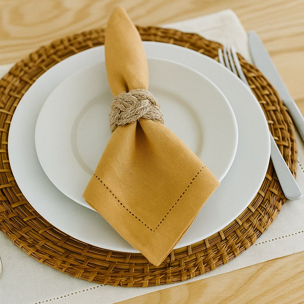 Eco-friendly natural jute napkin ring with a knotted design, styled on a linen napkin for farmhouse and coastal table decor.