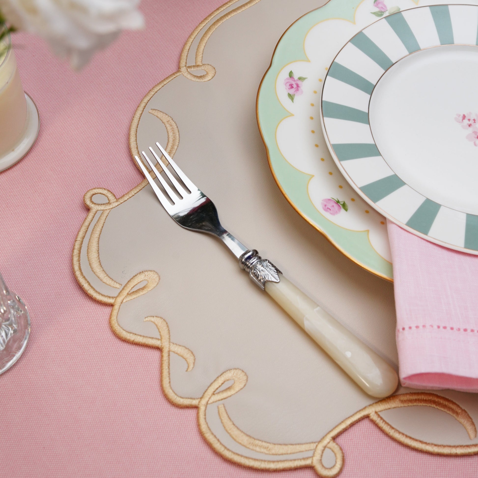 Vegan leather placemat with oval shape and matching coaster for tabletop decor