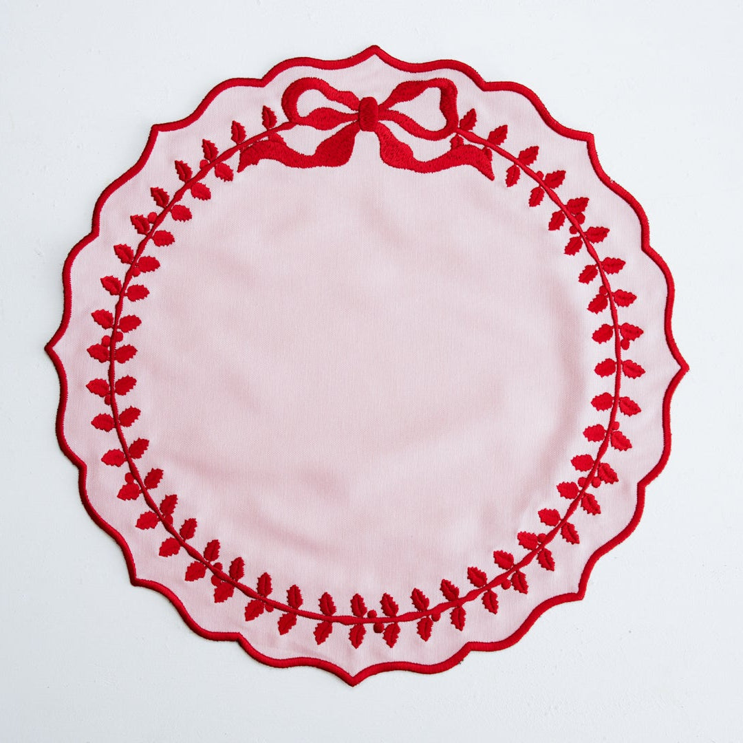 Elegant Champagne Pink Cotton Blend Round Placemat displayed on a dining table with scalloped embroidery edges, adding luxury and warmth to modern table decor.