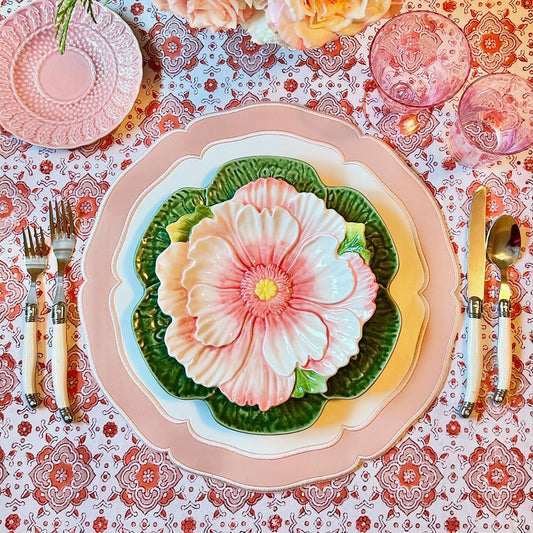 Pastel table decor highlighting the waterproof and stain-resistant Clarion pink-white mat for spring hosting