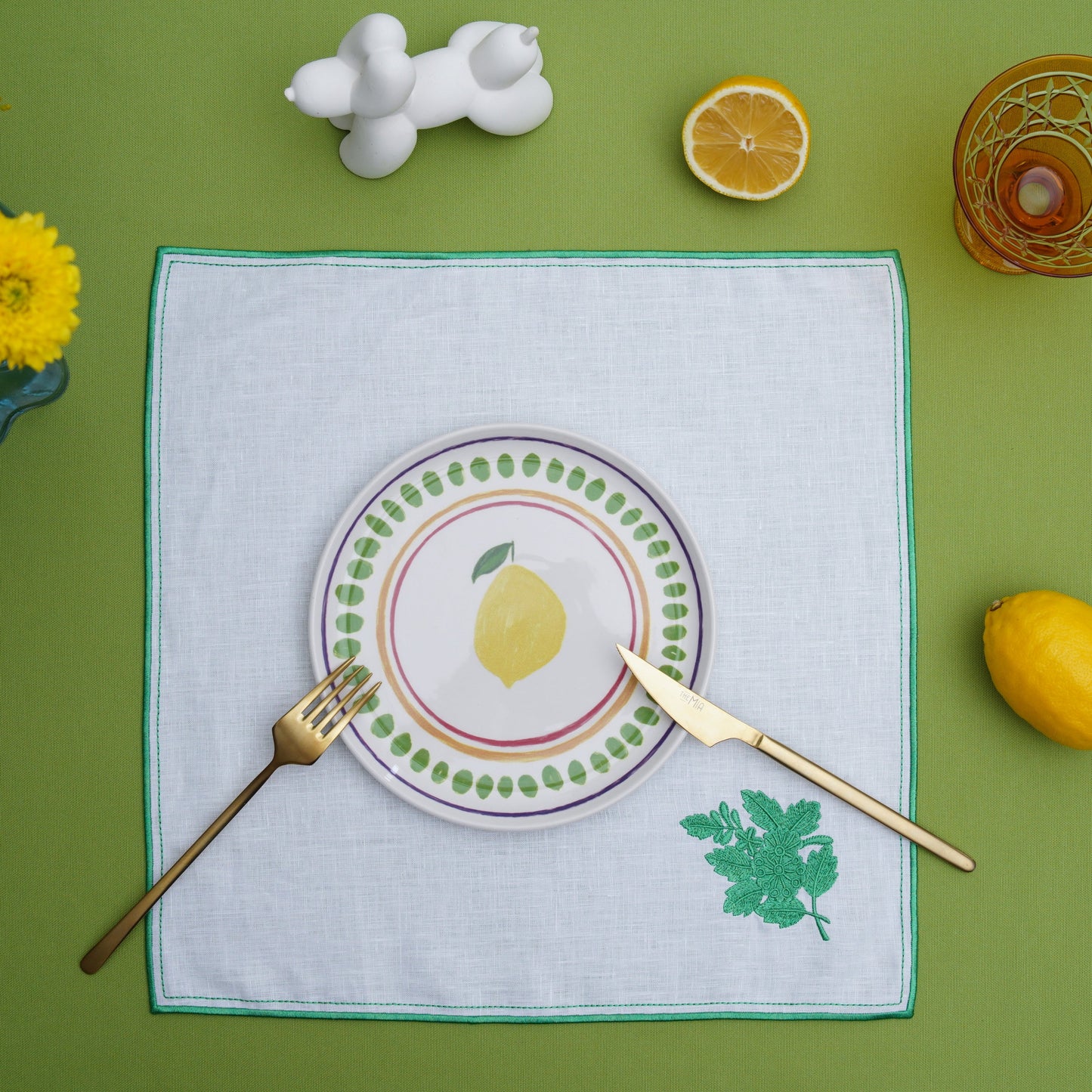 Handcrafted square placemat with artistic leaf detail for home decor