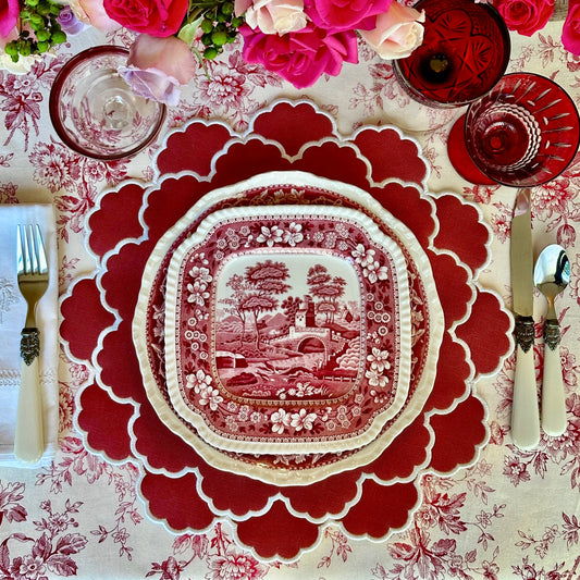 Timeless handcrafted red scalloped faux leather placemat, made from vegan materials with waterproof and sturdy design for all dining needs.