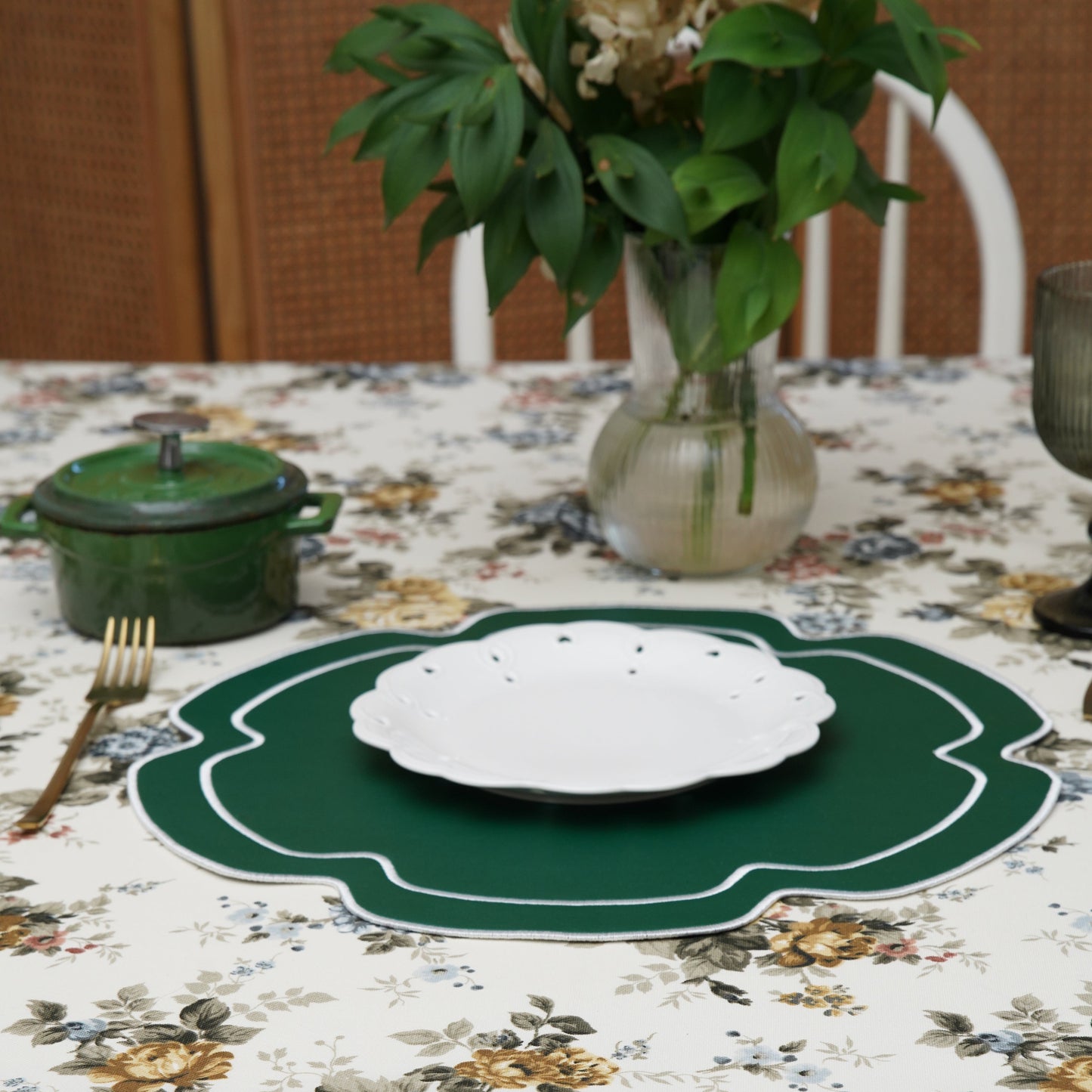 Close-up of embroidered vegan leather placemat arranged on a table